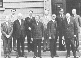 black and white photo of men in suits