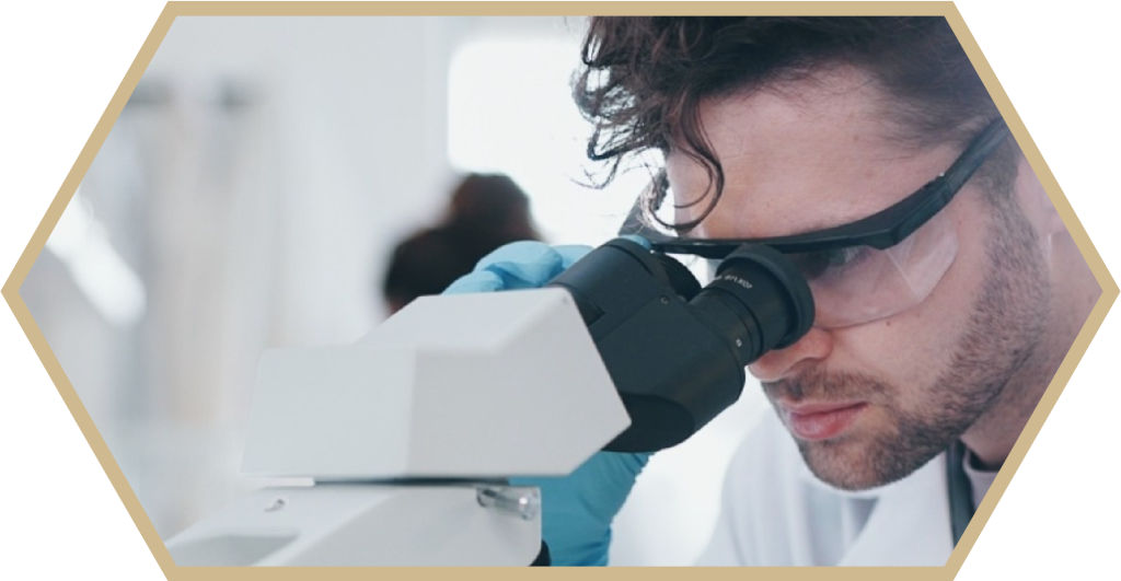 man looking into a microscope